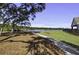 A well manicured backyard with a view of the lake at 7035 Pumpkinseed Dr, Johns Island, SC 29455