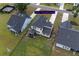 Aerial view of backyard with screened-in porch, manicured lawn, and a black fence at 7035 Pumpkinseed Dr, Johns Island, SC 29455