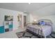Bedroom featuring a decorative metal bed frame, bright natural light and organized storage solutions at 7035 Pumpkinseed Dr, Johns Island, SC 29455
