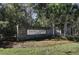 Stately entrance to Saint Johns Lake with brick pillars and lush landscaping, creating a welcoming arrival at 7035 Pumpkinseed Dr, Johns Island, SC 29455