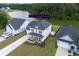 Charming two-story home with a covered front porch and view of the lake at 7035 Pumpkinseed Dr, Johns Island, SC 29455