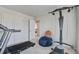 Home gym area with a treadmill and Bowflex, plus a doorway leading to another bedroom space at 7035 Pumpkinseed Dr, Johns Island, SC 29455