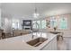 This kitchen features an island with bar seating and a sink, blending function with social space at 7035 Pumpkinseed Dr, Johns Island, SC 29455