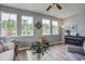 Comfortable living area with lots of natural light and hardwood floors at 7035 Pumpkinseed Dr, Johns Island, SC 29455
