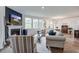 The living room showcases stylish seating, a modern fireplace, and abundant natural light at 7035 Pumpkinseed Dr, Johns Island, SC 29455