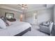 Beautiful main bedroom with chair and ensuite bathroom access at 7035 Pumpkinseed Dr, Johns Island, SC 29455