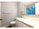 Bathroom featuring a white vanity, toilet, mirror, and blue shower curtain at 7621 Oldridge Rd, North Charleston, SC 29418