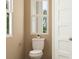 Cozy powder room featuring a toilet with white fixtures and a small window for natural light at 786 Ridgley Dr, Summerville, SC 29486