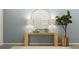 Inviting entryway featuring a wooden console table, decorative lamps, a round mirror, and stylish decor at 786 Ridgley Dr, Summerville, SC 29486