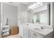 Bright bathroom with a large mirror, white cabinets, and a sink at 800 Heyward Cove Pl, Charleston, SC 29412