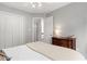 Neutral bedroom features a large window, a dresser and closet and neutral wall paint at 800 Heyward Cove Pl, Charleston, SC 29412