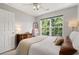 Comfortable bedroom features a large window with natural lighting and neutral wall paint at 800 Heyward Cove Pl, Charleston, SC 29412