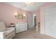 Bedroom features a glider, a dresser and natural lighting from a large window at 800 Heyward Cove Pl, Charleston, SC 29412