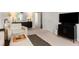 Bright bonus room featuring neutral carpeting, comfortable seating arrangement, and a modern ceiling fan at 800 Heyward Cove Pl, Charleston, SC 29412