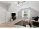 Bright bonus room featuring neutral carpeting, comfortable seating arrangement, and a modern ceiling fan at 800 Heyward Cove Pl, Charleston, SC 29412