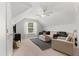 Bright bonus room featuring neutral carpeting, comfortable seating arrangement, and a modern ceiling fan at 800 Heyward Cove Pl, Charleston, SC 29412
