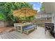 Inviting outdoor deck features an umbrella-covered dining area, offering a perfect space for relaxation and entertainment at 800 Heyward Cove Pl, Charleston, SC 29412