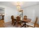 Bright dining area with chandelier, table with seating, and open layout to the kitchen at 800 Heyward Cove Pl, Charleston, SC 29412