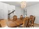 Elegant dining room featuring modern chandelier, table with seating for six, and access to other rooms at 800 Heyward Cove Pl, Charleston, SC 29412