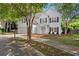 Charming two-story home nestled among mature trees, offering curb appeal at 800 Heyward Cove Pl, Charleston, SC 29412