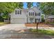 Charming two-story home with a well-manicured lawn and a two car attached garage at 800 Heyward Cove Pl, Charleston, SC 29412
