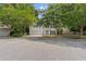 Charming two-story home with a large front yard and mature trees enhancing the curb appeal at 800 Heyward Cove Pl, Charleston, SC 29412