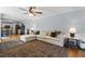 Spacious living room with a sectional sofa, hardwood floors, and an open layout at 800 Heyward Cove Pl, Charleston, SC 29412
