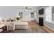 Bright living room with fireplace, hardwood floors, and a cozy seating area at 800 Heyward Cove Pl, Charleston, SC 29412