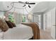 Comfortable main bedroom featuring vaulted ceiling, neutral colors, and two windows offering plenty of natural light at 800 Heyward Cove Pl, Charleston, SC 29412