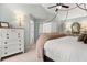 Well-appointed main bedroom showcases a four-poster bed, stylish furniture, and soft lighting, offering a serene ambiance at 800 Heyward Cove Pl, Charleston, SC 29412