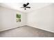 Well-lit bedroom with neutral carpet and a window overlooking exterior at 8112 Halifax Way, North Charleston, SC 29420