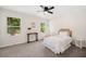 Bright bedroom with comfortable bed, stylish decor, and natural light from large windows at 8112 Halifax Way, North Charleston, SC 29420