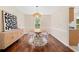 Well-lit dining room featuring a round table, stylish chairs, and a decorative chandelier at 8112 Halifax Way, North Charleston, SC 29420