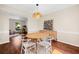 Open dining area with a round table, modern chairs, and access to the living room at 8112 Halifax Way, North Charleston, SC 29420