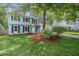 Charming two-story home with light blue siding, black shutters, and a well-manicured lawn at 8112 Halifax Way, North Charleston, SC 29420