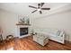 Living room with a fireplace, hardwood floors, and a comfortable white sofa at 8112 Halifax Way, North Charleston, SC 29420