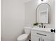Clean powder room featuring vanity, modern fixtures, and a decorative mirror at 8112 Halifax Way, North Charleston, SC 29420