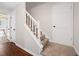 Carpeted staircase with white railing leading to upper level, with visible door at 8112 Halifax Way, North Charleston, SC 29420