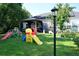 Spacious backyard with a covered patio and playset, perfect for outdoor fun at 8127 Saveur Ln, Charleston, SC 29406