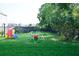 Backyard featuring an small playset and shade trees in the grass yard at 8127 Saveur Ln, Charleston, SC 29406