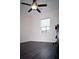 This room features a ceiling fan, window, wood floors, and a desk at 8127 Saveur Ln, Charleston, SC 29406