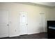 Bedroom with three doors, showing access to closets or the bathroom at 8127 Saveur Ln, Charleston, SC 29406