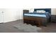Bedroom with a dark, plush rug, dark wood floors, and a dark wood bed at 8127 Saveur Ln, Charleston, SC 29406