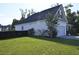 Exterior showing a large yard and side of the house with an attached two-car garage at 8127 Saveur Ln, Charleston, SC 29406