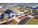 Beautiful aerial view of the community garden, clubhouse, and surrounding neighborhood with lake view at 87 French Garden Cir, Summerville, SC 29486
