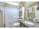 Well-lit bathroom featuring a granite countertop vanity, shower with curtain, and ample storage space at 9101 Parlor Dr, Ladson, SC 29456