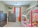 Cozy bedroom featuring playful decor, a comfortable bed, and ample natural light through the window at 9101 Parlor Dr, Ladson, SC 29456