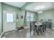 Cozy dining area featuring wood floors, a table with six chairs and a modern chandelier providing ample lighting at 9101 Parlor Dr, Ladson, SC 29456