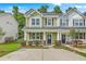 Charming two-story house with a well-maintained lawn, cozy front porch and double hung windows at 9101 Parlor Dr, Ladson, SC 29456