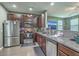 Modern kitchen with stainless steel appliances, granite countertops, and dark wood cabinetry at 9101 Parlor Dr, Ladson, SC 29456